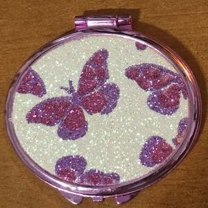 Pocket-size mirror with glittering cover